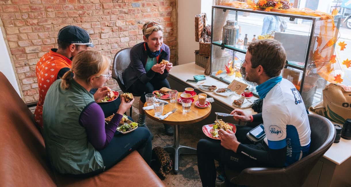 Cyclists enjoying coffee and something to eat at Cafe Isola, Isle of Wight